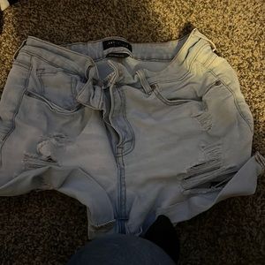 Booty shorts they are 57% cotton 22% polyester. You can wash them and dry them.